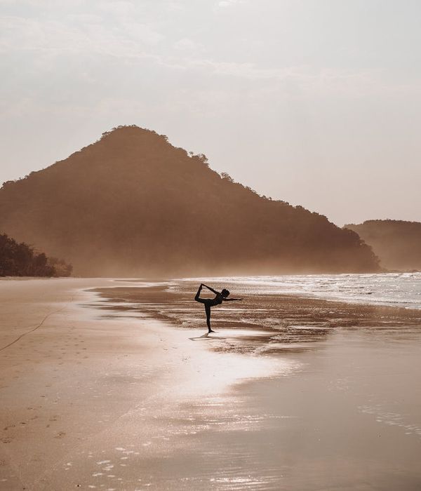 Woman in a calm yoga pose, embodying harmony and balance.